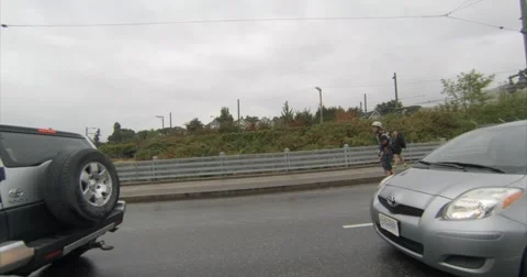 Unsafe skateboarding in traffic Stock Footage 55610531