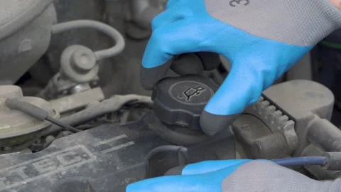 Unscrew the engine filler plug Stock-Footage 201153925
