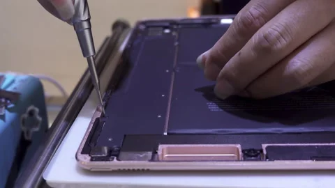 Unscrewing inside an Ipad,4K Stock Footage 315098897