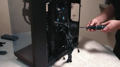 Unscrewing mounting drive bay for SSD and hard drives in computer case Stock Footage 335072024