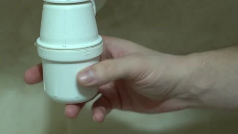 Unscrewing the siphon under the sink close-up Stock Footage 153132348