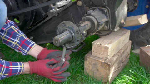 Unscrews the nut of the tractor Video stock 147047556
