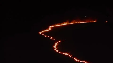Unseen Winds, Bright Flames, Meadow Quiet Ruin. Aerial Drone Shot. Stock Footage 257767162