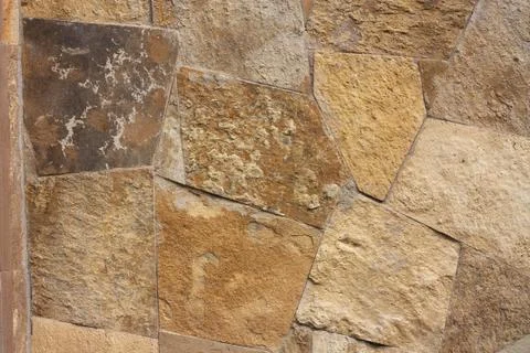 Unshaped stone wall pattern,wall made of rocks Stock Photos
