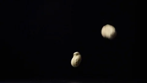 Unshelled peanuts in the shell falls on a table slow mo Stock Footage 73229119