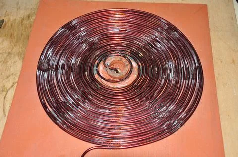 Unshielded copper wire wound to form a disc Stock Photos