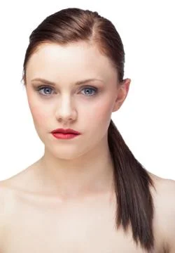 Unsmiling gorgeous model with ponytail posing Stock Photos