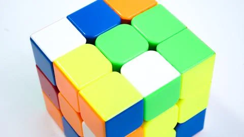 Unsolved 3x3 Rubik's Cube on White Background Stock Photos