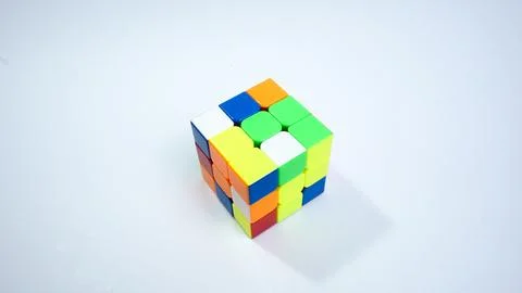 Unsolved 3x3 Rubik's Cube on White Background Stock Photos