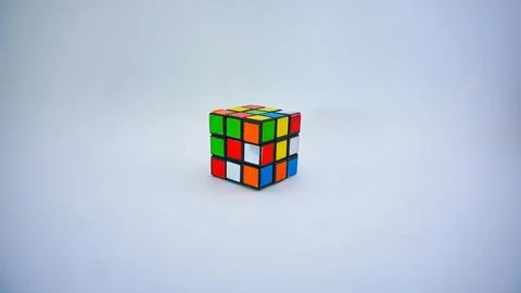 Unsolved Rubik's cube against a white background. Stock Photos