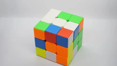Unsolved Rubik's Cube on White Background Foto stock
