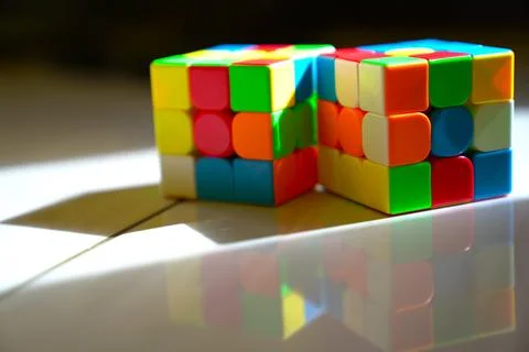 Unsolved Rubik's cubes with dark background Stock Photos
