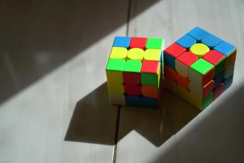 Unsolved Rubik's cubes with dark background Stock Photos