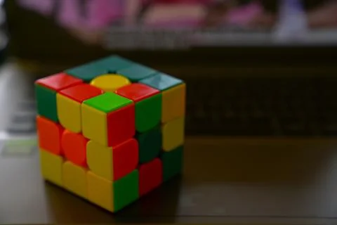 Unsolved Rubik's cubes with dark background Stock Photos