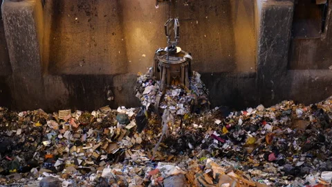 Unsorted garbage is collected by a special crane claw for incineration factory. Stock Footage 234674771