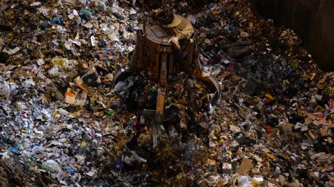 Unsorted garbage is collected by a special crane claw for incineration factory. 스톡 동영상 234680378
