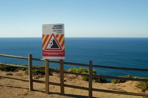 Unstable cliffs warning sign in Cabo De Roca Portugal Stock Photos
