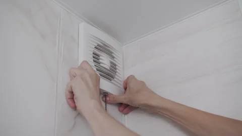 Unsuccessful Attempt to Open Stuck Bathroom Exhaust Fan Cover Vídeo Stock 341396502
