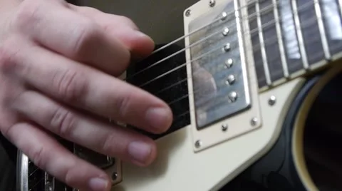 Unsuccessful exercises on the guitar Stock Footage 64274844