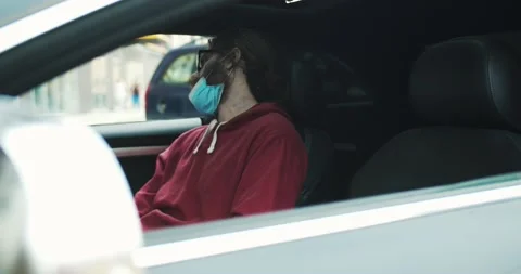 Unsuspecting young man getting into the car while spooky zombie sitting inside Stock Footage 134946312