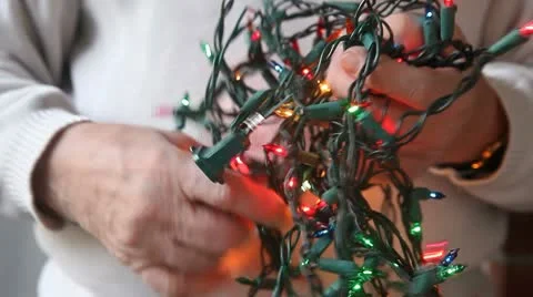 Untangling Christmas lights Stock Footage 9774801
