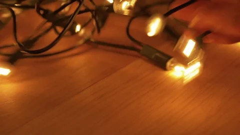 Untangling Christmas Lights Stock Footage 69824273