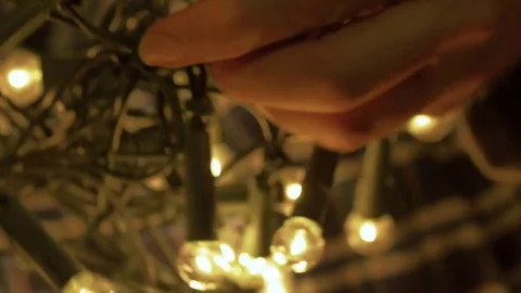 Untangling Christmas Lights Stock Footage 69825673