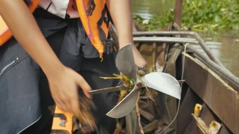 Untangling Plastic from Propeller on the Mekong River, Vietnam Stock Footage 284766943