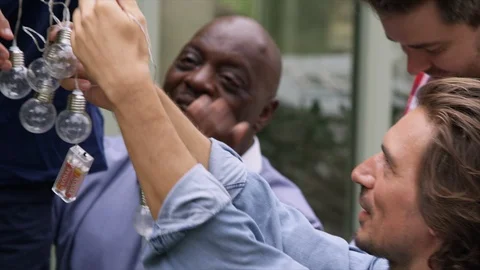 Untangling string light Stock Footage 129917611