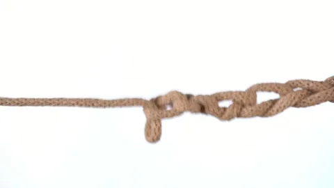 Untangling uncoupling knitted loops close up slow motion. Stock Footage 234650922