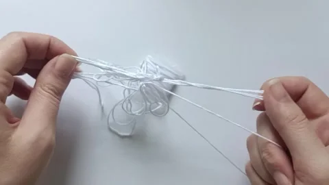 Untangling White Embroidery Thread by Hand Close Up. 스톡 동영상 340123115