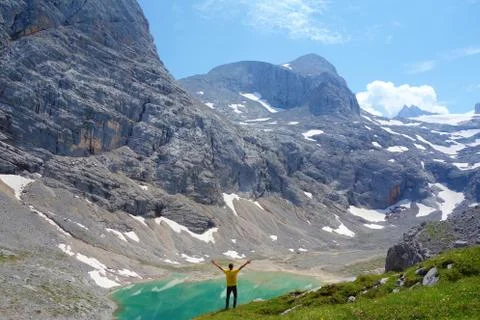 Unterer Eissee with a young man under the Dachstein glacier near to Simonyhtt Stock Photos
