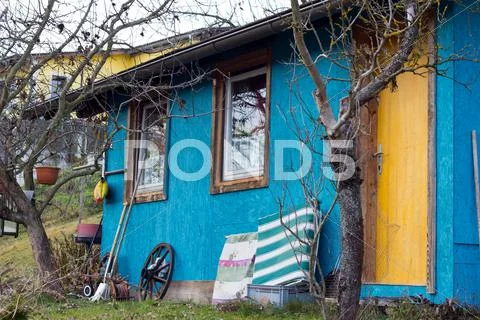 Untidy small blue house Stock Photos