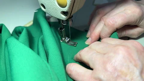 Untitled Sewing work. Stitching a hole in jeans with a sewing machine. Stock Footage 265908273