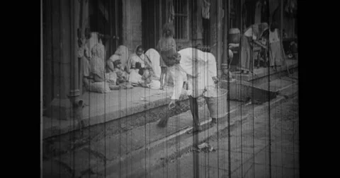 Untouchables sweeping the street in India Stock Footage