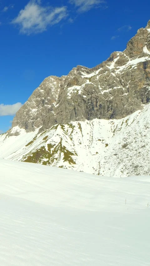 Untouched snow trail winding through pine forests near Oberstdorf in the Allg Stock Footage 308295986