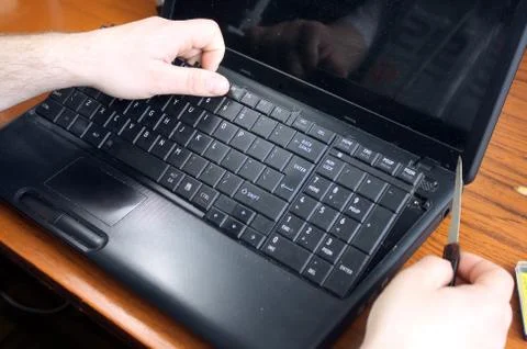 Untwisting of laptop Stock Photos
