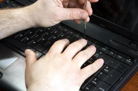 Untwisting of laptop Stock Photos