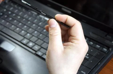 Untwisting of laptop Stock Photos