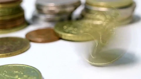 Unusual background from coins of different countries. The coin rotates and stops Stock Footage 80990948