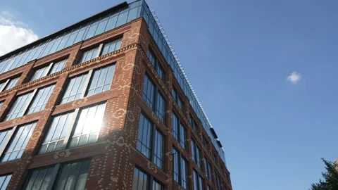 Unusual brick building with panoramic large windows. bottom view. glass brick Stock Footage 164930068