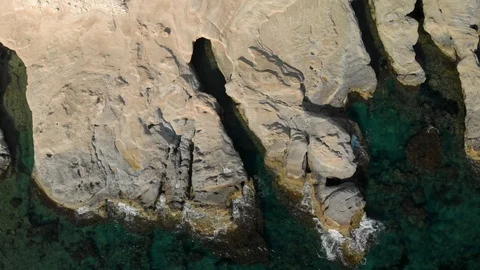 Unusual cliffs on the seashore.  Beach and sea. 4K Stock Footage 104656360