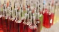 Unusual colored bottles with delicious drinks. Great pool party. Good mood HD Footage