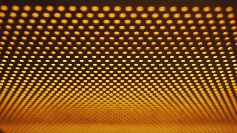 Unusual light. A glowing yellow panel of round bulbs. Wandering focus. Defocus Stock Footage 129363788