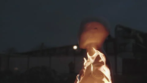 Unusual mannequin catches fire in dramatic display at nighttime location Stock Footage 320050640
