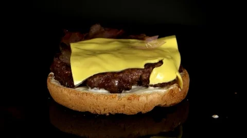 Unusual process of appearing the burger ingredients Stock Footage 75254097