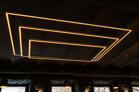 Unusual rectangular design lamps on the ceiling in an expensive restaurant. I 스톡 사진