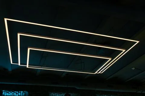 Unusual rectangular design lamps on the ceiling in an expensive restaurant. I Stock Photos