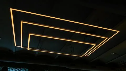 Unusual rectangular design lamps on the ceiling in an expensive restaurant. I Stock Photos