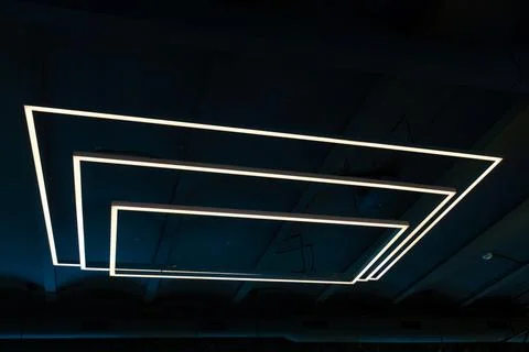 Unusual rectangular design lamps on the ceiling in an expensive restaurant. I Stock Photos